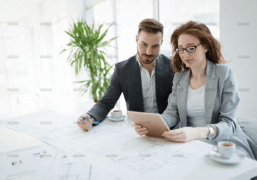 demo-attachment-877-portrait-of-young-architect-woman-on-meeting-KFZCE3A